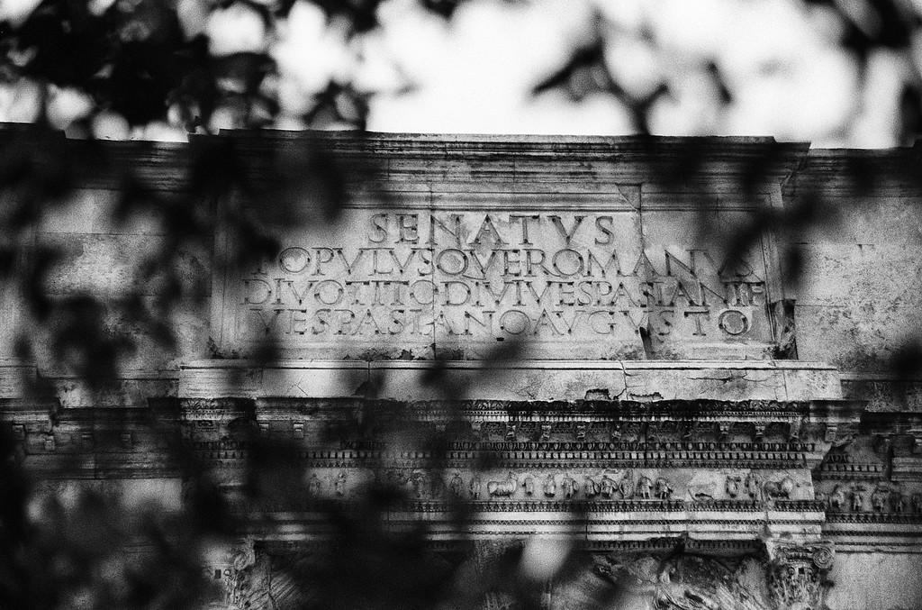 Arch of Titus "The Senate and People of Rome, to Divus Titus, son of Divus Vespasian, Vespasian Augustus" - Roman Forum in Rome, Italy